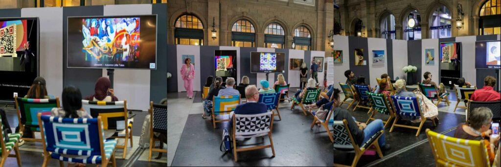 Des collectionneurs observent à Zurich l’œuvre « The Architect of the Invisible » de l’artiste LEGO qargo, exposée à la Swiss Art Expo 2025.